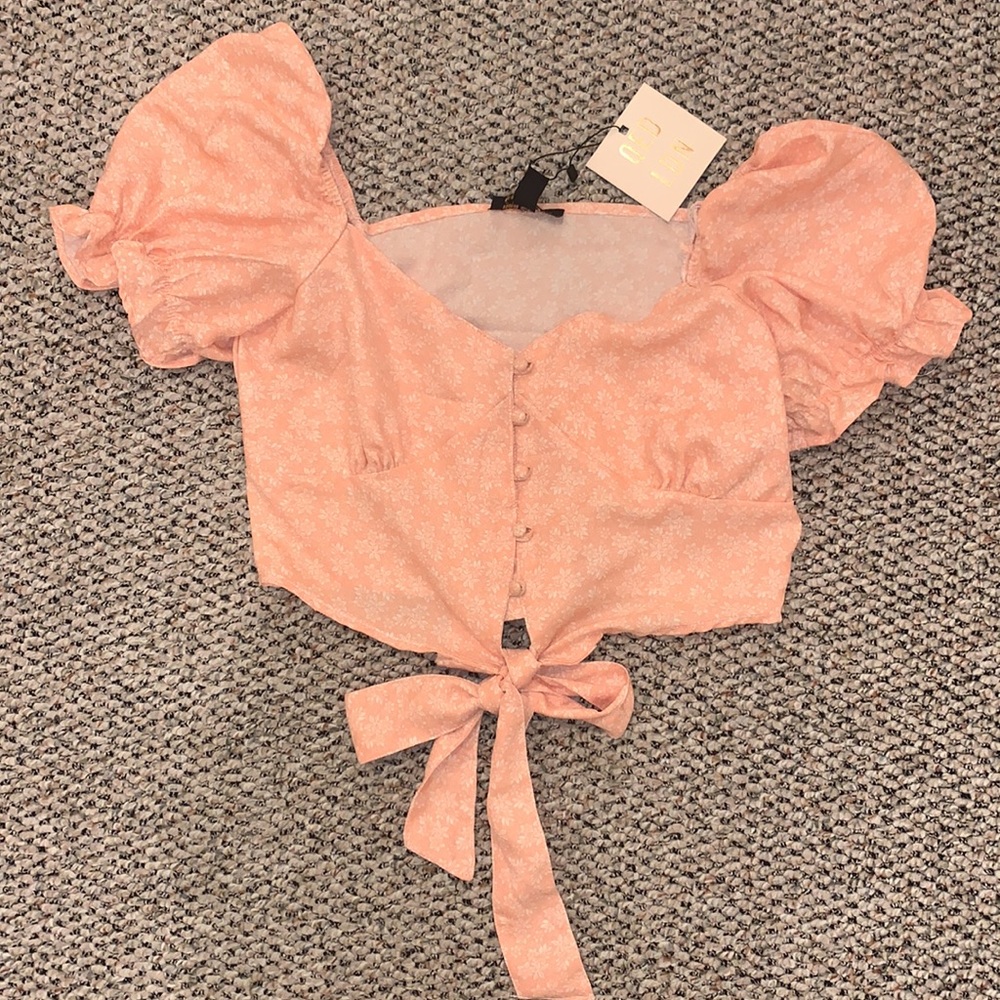 Pink with cream flower pattern crop top.